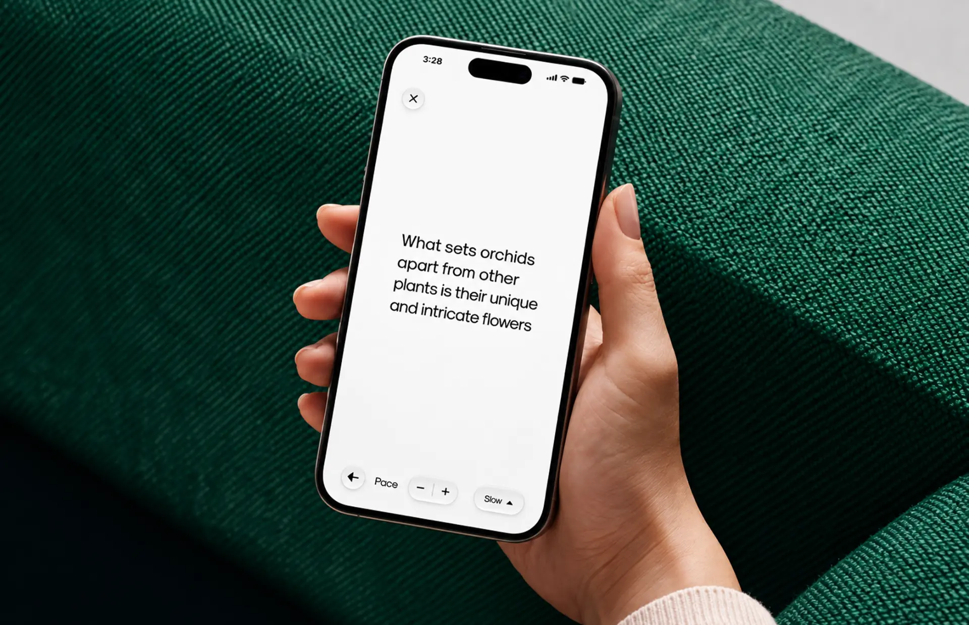 Hand holding a phone showing the Orchid reading screen