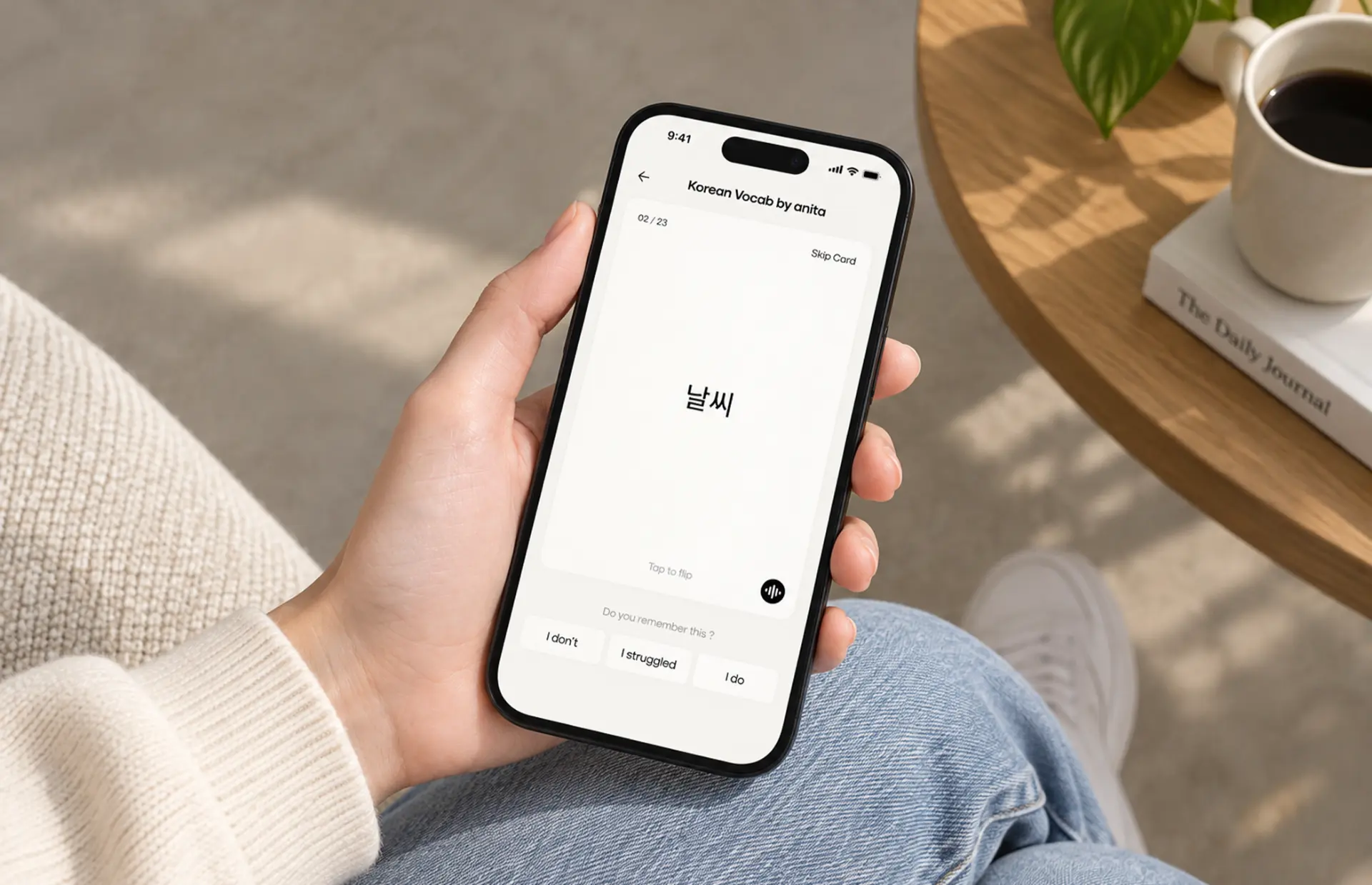 Phone showing the Anki redesign flashcard screen held in hand